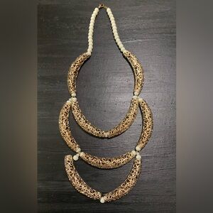 Symmetrical, white and gold necklace